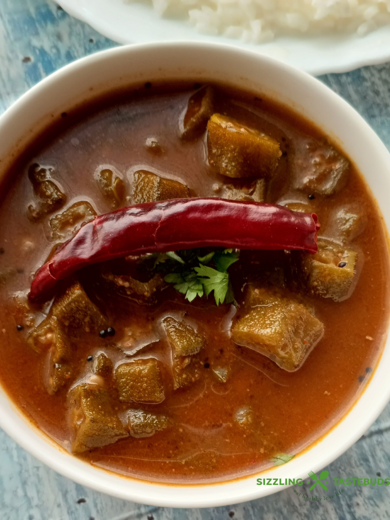 Benedekayi Gojju is a traditional recipe from Mysore region of Karnataka, referring to sautéed okra in a tangy, spicy sauce. Served with hot rice, curd rice or chapatis.