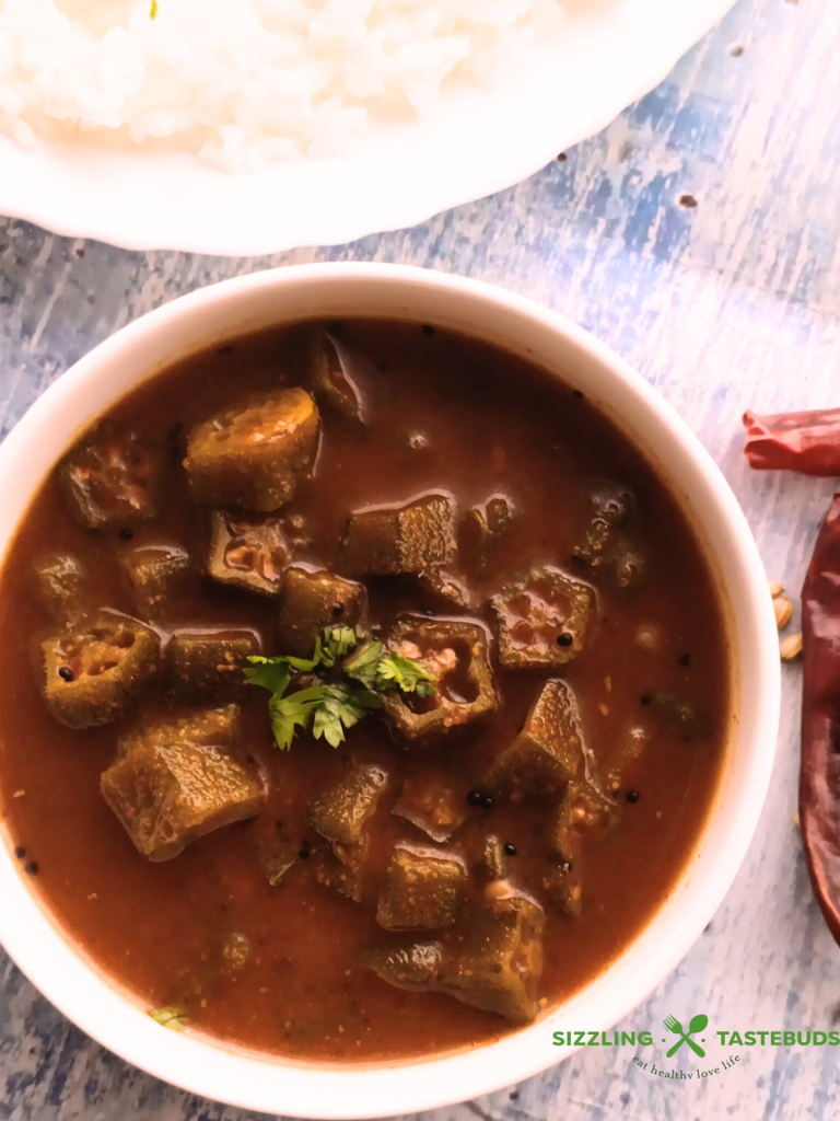 Benedekayi Gojju is a traditional recipe from Mysore region of Karnataka, referring to sautéed okra in a tangy, spicy sauce. Served with hot rice, curd rice or chapatis.