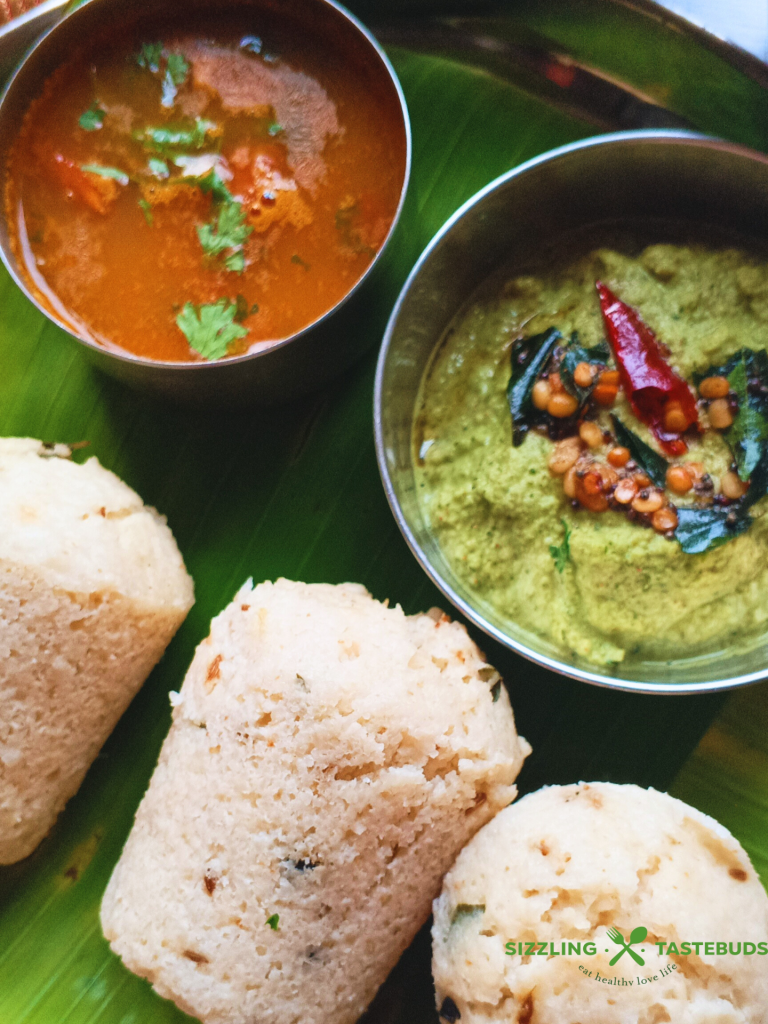 Kanchipuram Idli, a traditional dish from Tamil Nadu, is a spiced, steamed rice cake known for its unique blend of cumin, pepper, and ginger, offering a savory twist on the traditional Idli.