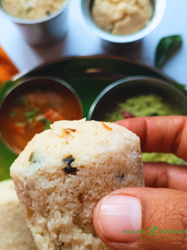 Kanchipuram Idli, a traditional dish from Tamil Nadu, is a spiced, steamed rice cake known for its unique blend of cumin, pepper, and ginger, offering a savory twist on the traditional Idli.