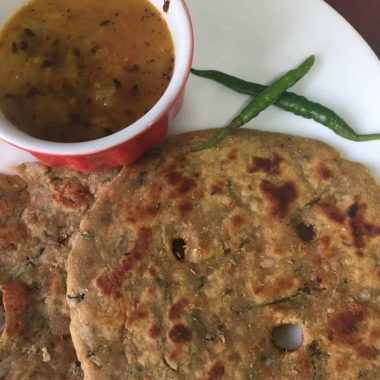 Multigrain Thalipeeth is a Gluten Free and Vegan flatbread combining millet flours and basic pantry spices to a spicy flatbread. Served with yogurt or pickle for a filling meal.